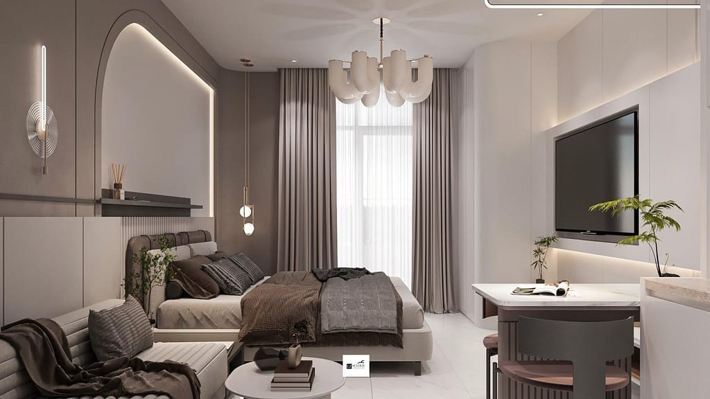 A modern bedroom with neutral tones features a bed, gray sofa, round chandelier, wall-mounted TV, dining table with chairs, large window with sheer curtains, and minimalistic decor including plants and pendant lights.